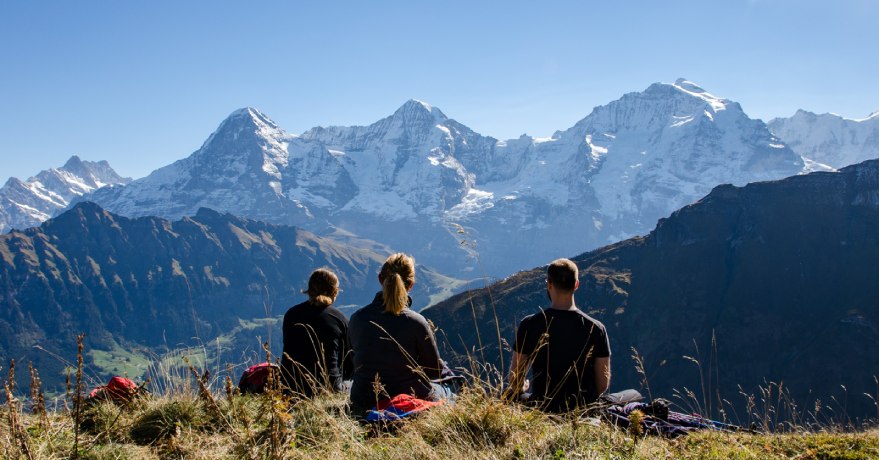 people sitting on mountain top