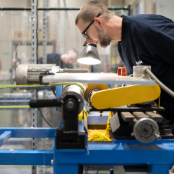 A man working operating a machine