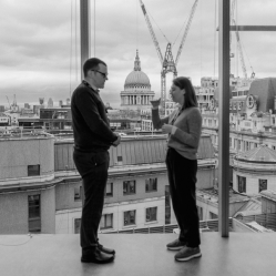 Two persons are discussing